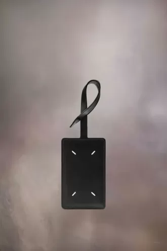 Etichetta per bagaglio con quattro punti