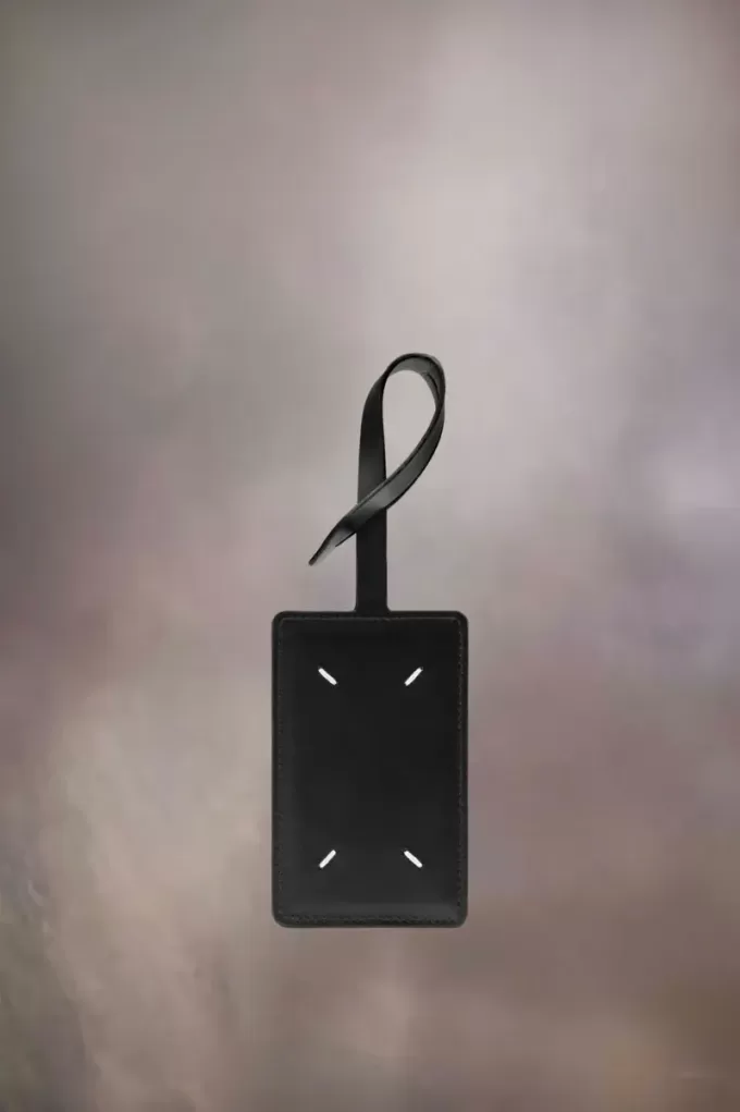 Etichetta per bagaglio con quattro punti